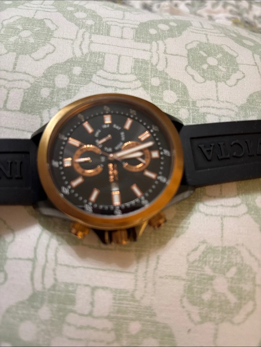 Invicta Specialty GMT watch, featuring a rose gold-tone case and a black dial.